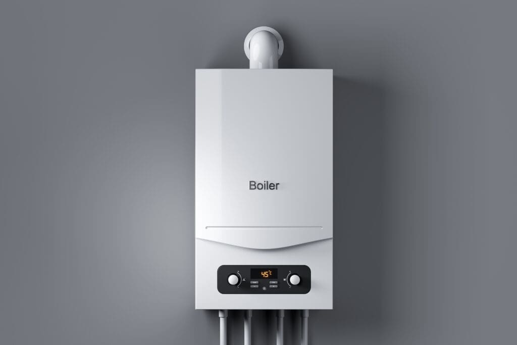 A modern white boiler mounted on a gray wall with a digital control panel displaying "45°C." Several pipes are connected at the bottom, and a vent pipe extends from the top.